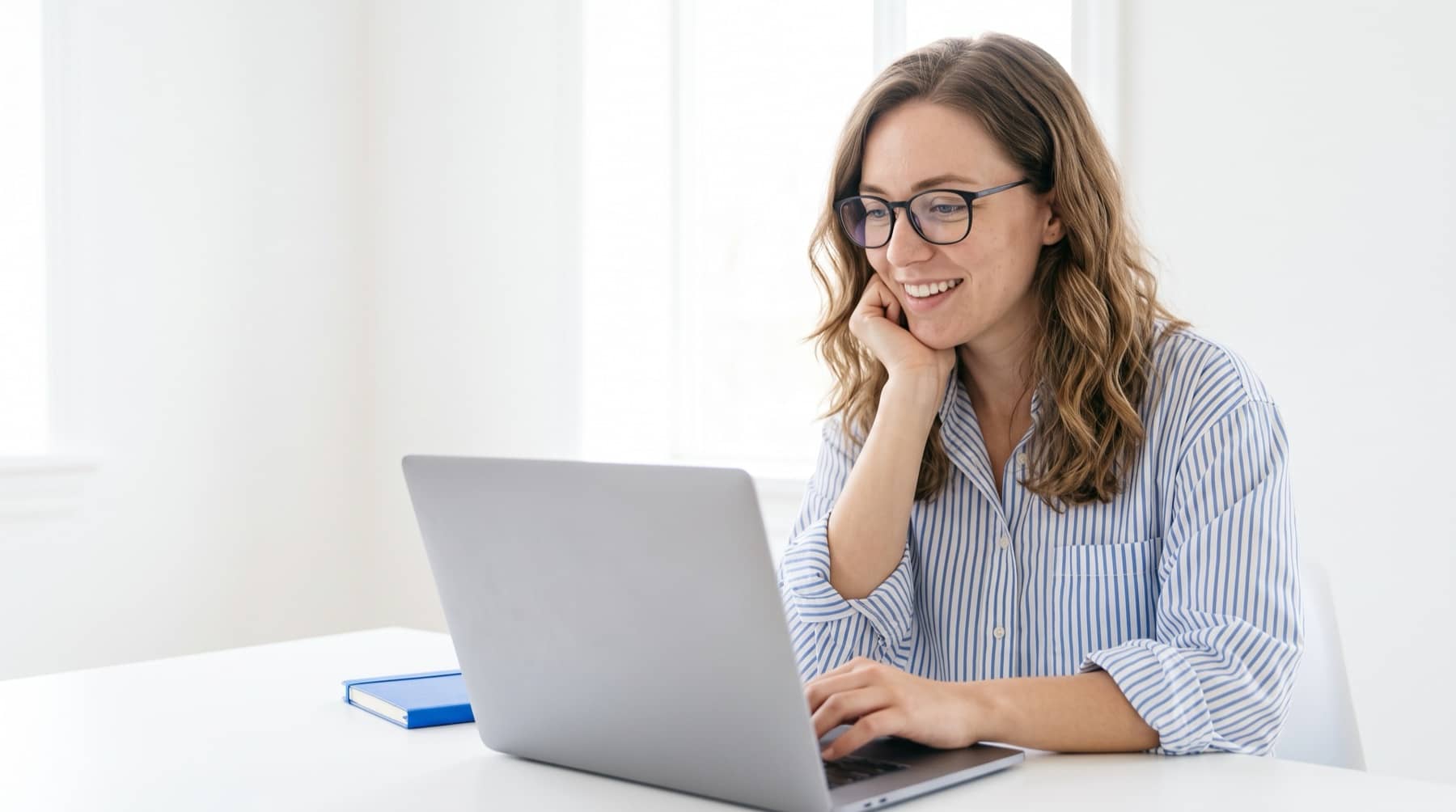 Team member working at a laptop